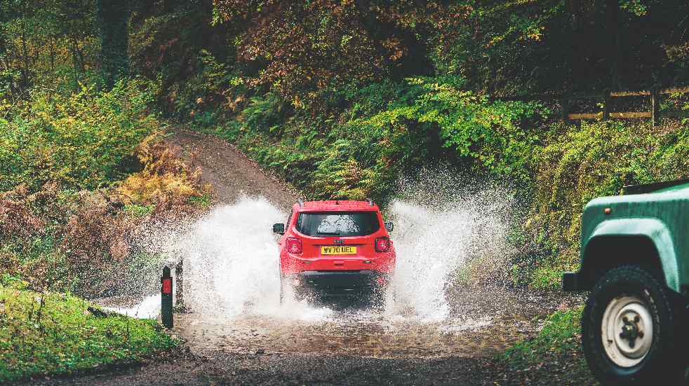 Jeep splashing in river